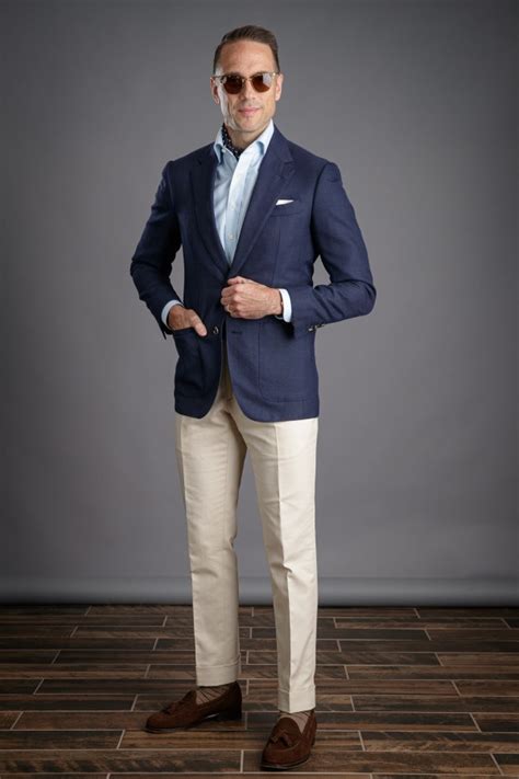 blue sports jacket khaki pants.